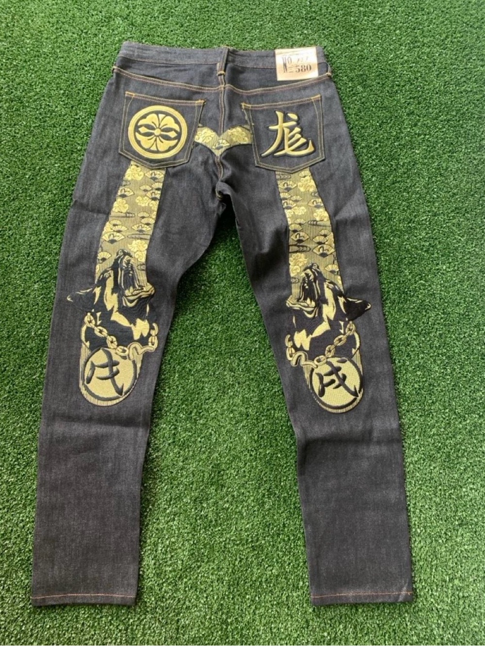 Evisu Black Denim Jeans with Gold Graphic Back Panels